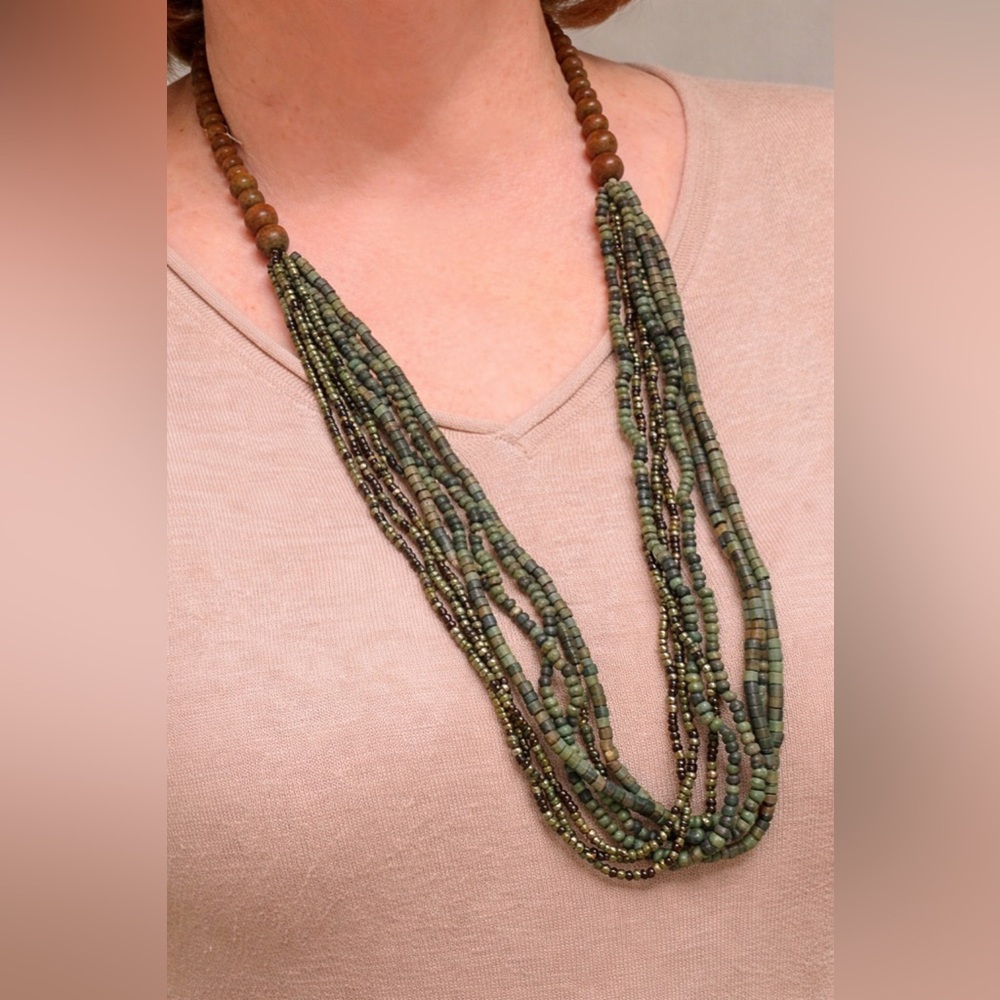 Layered Bohemian style necklace with several strands of mixed length beads